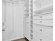 Walk-in closet with custom built-in shelving and drawers for optimal organization at 553 Fox Chase Dr., Conway, SC 29527