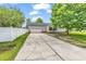 Long driveway leading to a two-car garage, complemented by a well-maintained yard at 553 Fox Chase Dr., Conway, SC 29527
