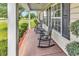 Charming front porch with rocking chairs, inviting relaxation and showcasing curb appeal at 553 Fox Chase Dr., Conway, SC 29527