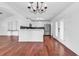 Modern kitchen boasting stainless steel appliances, white cabinetry, and black backsplash at 553 Fox Chase Dr., Conway, SC 29527