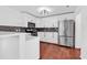 Modern kitchen featuring stainless steel appliances, white cabinets, and bar seating at 553 Fox Chase Dr., Conway, SC 29527