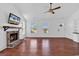 Inviting living room with a brick fireplace, hardwood floors, and lots of natural light at 553 Fox Chase Dr., Conway, SC 29527