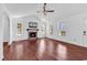 Spacious living room showcasing hardwood floors, fireplace and bright natural light at 553 Fox Chase Dr., Conway, SC 29527