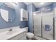 Bathroom featuring a walk-in shower, toilet, sink vanity, and rounded mirror at 562 Blue Stem Dr. # 54-F, Pawleys Island, SC 29585