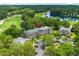 Aerial view of condominiums surrounded by lush landscaping, golf course and water features at 562 Blue Stem Dr. # 54-F, Pawleys Island, SC 29585