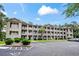 Lovely condo building with balconies, verdant lawns, and designated parking at 562 Blue Stem Dr. # 54-F, Pawleys Island, SC 29585
