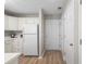 Bright kitchen with wood-style floors and ample storage space at 562 Blue Stem Dr. # 54-F, Pawleys Island, SC 29585