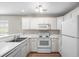 Updated kitchen featuring white appliances and cabinetry at 562 Blue Stem Dr. # 54-F, Pawleys Island, SC 29585