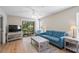 Inviting living room boasts wood-style floors, comfortable seating, and access to an outdoor patio at 562 Blue Stem Dr. # 54-F, Pawleys Island, SC 29585