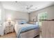 Comfortable main bedroom with wooden furnishings, a ceiling fan, and natural light at 562 Blue Stem Dr. # 54-F, Pawleys Island, SC 29585