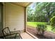 Cozy screened-in patio with chairs and views of the lush landscaping at 562 Blue Stem Dr. # 54-F, Pawleys Island, SC 29585