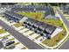 An aerial view of a modern neighborhood featuring townhomes, green spaces, and ample parking at 563 Sea Sparrow St. # 563, Myrtle Beach, SC 29588