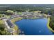 Aerial view of homes surrounding a big blue lake, all surrounded by green vegetation at 563 Sea Sparrow St. # 563, Myrtle Beach, SC 29588