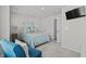 Comfortable bedroom featuring light walls, carpeted floors, and a wall mounted television at 563 Sea Sparrow St. # 563, Myrtle Beach, SC 29588