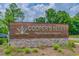 Cooper's Bluff community sign: The Highlands & Waterside, surrounded by lush greenery and vibrant flowers at 563 Sea Sparrow St. # 563, Myrtle Beach, SC 29588