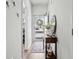 Bright entryway with a decorated console table, wood flooring, and a view of the front door at 563 Sea Sparrow St. # 563, Myrtle Beach, SC 29588