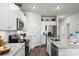 Well-lit kitchen with white cabinets, granite countertops, and stainless-steel appliances at 563 Sea Sparrow St. # 563, Myrtle Beach, SC 29588