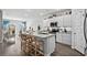 Modern kitchen featuring white cabinets, stainless steel appliances, and a granite island with seating at 563 Sea Sparrow St. # 563, Myrtle Beach, SC 29588