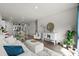 Bright and airy living area featuring wood floors, a modern sofa, and an open layout at 563 Sea Sparrow St. # 563, Myrtle Beach, SC 29588