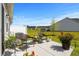 Cozy patio with wicker chairs, decorative plants, and views of the green lawn at 563 Sea Sparrow St. # 563, Myrtle Beach, SC 29588