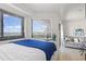 Bright bedroom featuring a large window with blinds and balcony access at 5905 S Kings Highway # 1206-C, Myrtle Beach, SC 29575