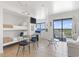 View of open floor plan featuring bunk beds, dining area, and an adjacent balcony with city views at 5905 S Kings Highway # 1206-C, Myrtle Beach, SC 29575