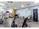 Well-equipped fitness center with treadmills, elliptical, and weight machines for resident use at 5905 S Kings Highway # 1206-C, Myrtle Beach, SC 29575