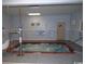 Inviting indoor hot tub area with safety railings and clear signage for residents at 5905 S Kings Highway # 1206-C, Myrtle Beach, SC 29575