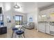 Living room featuring dining area, comfortable seating, and an adjacent balcony with view at 5905 S Kings Highway # 1206-C, Myrtle Beach, SC 29575