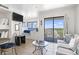 Living room featuring dining area, comfortable seating, and an adjacent balcony with city view at 5905 S Kings Highway # 1206-C, Myrtle Beach, SC 29575