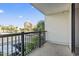 Enjoy the neighborhood view from this condo's balcony with black metal railings at 601 Mitchell Dr. # 207, Myrtle Beach, SC 29577