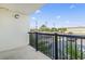 Relax on the balcony with neighborhood views and black metal railings at 601 Mitchell Dr. # 207, Myrtle Beach, SC 29577