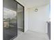 Condo balcony with view of surrounding neighborhood and sliding glass doors at 601 Mitchell Dr. # 207, Myrtle Beach, SC 29577