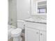 A modern bathroom featuring tiled shower, white vanity with marble countertop, and toilet at 601 Mitchell Dr. # 207, Myrtle Beach, SC 29577