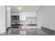 Bright kitchen featuring gray granite counters and stainless-steel appliances at 601 Mitchell Dr. # 207, Myrtle Beach, SC 29577