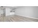 Bright living room with hardwood floors and bar with granite countertops at 601 Mitchell Dr. # 207, Myrtle Beach, SC 29577