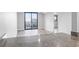 Open living room and sliding doors leading to a balcony with views of the ocean at 601 Mitchell Dr. # 207, Myrtle Beach, SC 29577
