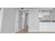 Bright living room featuring hardwood floors and a bar with granite countertops at 601 Mitchell Dr. # 207, Myrtle Beach, SC 29577