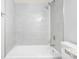A clean shower with a tiled wall, shower head, and faucet at 601 Mitchell Dr. # 207, Myrtle Beach, SC 29577