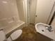 Clean bathroom features tile flooring, vanity sink, toilet, and a combination tub and shower at 601 Putters Ln. # H209, Little River, SC 29566