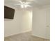 Bright bedroom with neutral carpet, a ceiling fan, and space for personalized decor at 601 Putters Ln. # H209, Little River, SC 29566