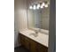 Well-lit bathroom features wood cabinets, vanity and a large mirror at 615 Todd Blvd., Conway, SC 29526