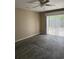 Comfortable bedroom with carpet flooring and sliding glass doors to the backyard at 615 Todd Blvd., Conway, SC 29526