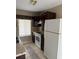 Functional kitchen featuring dark wood cabinets and white appliances at 615 Todd Blvd., Conway, SC 29526