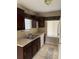 Efficient kitchen with dark wood cabinets, and a stainless steel sink at 615 Todd Blvd., Conway, SC 29526