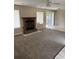 Living room with fireplace, carpet flooring, and sliding glass doors to the backyard at 615 Todd Blvd., Conway, SC 29526