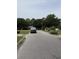 Neighborhood street view featuring a well-kept lawn and a white pickup truck at 615 Todd Blvd., Conway, SC 29526