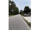 Quiet street view featuring well-maintained lawns and mature trees in a residential neighborhood at 615 Todd Blvd., Conway, SC 29526