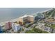 Aerial view of a resort hotel with parking, easy beach access, and nearby shopping and attractions at 6900 N Ocean Blvd. # 915, Myrtle Beach, SC 29572