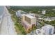 Beautiful aerial view of a beachside resort with nearby businesses, parking, and landscaping at 6900 N Ocean Blvd. # 915, Myrtle Beach, SC 29572